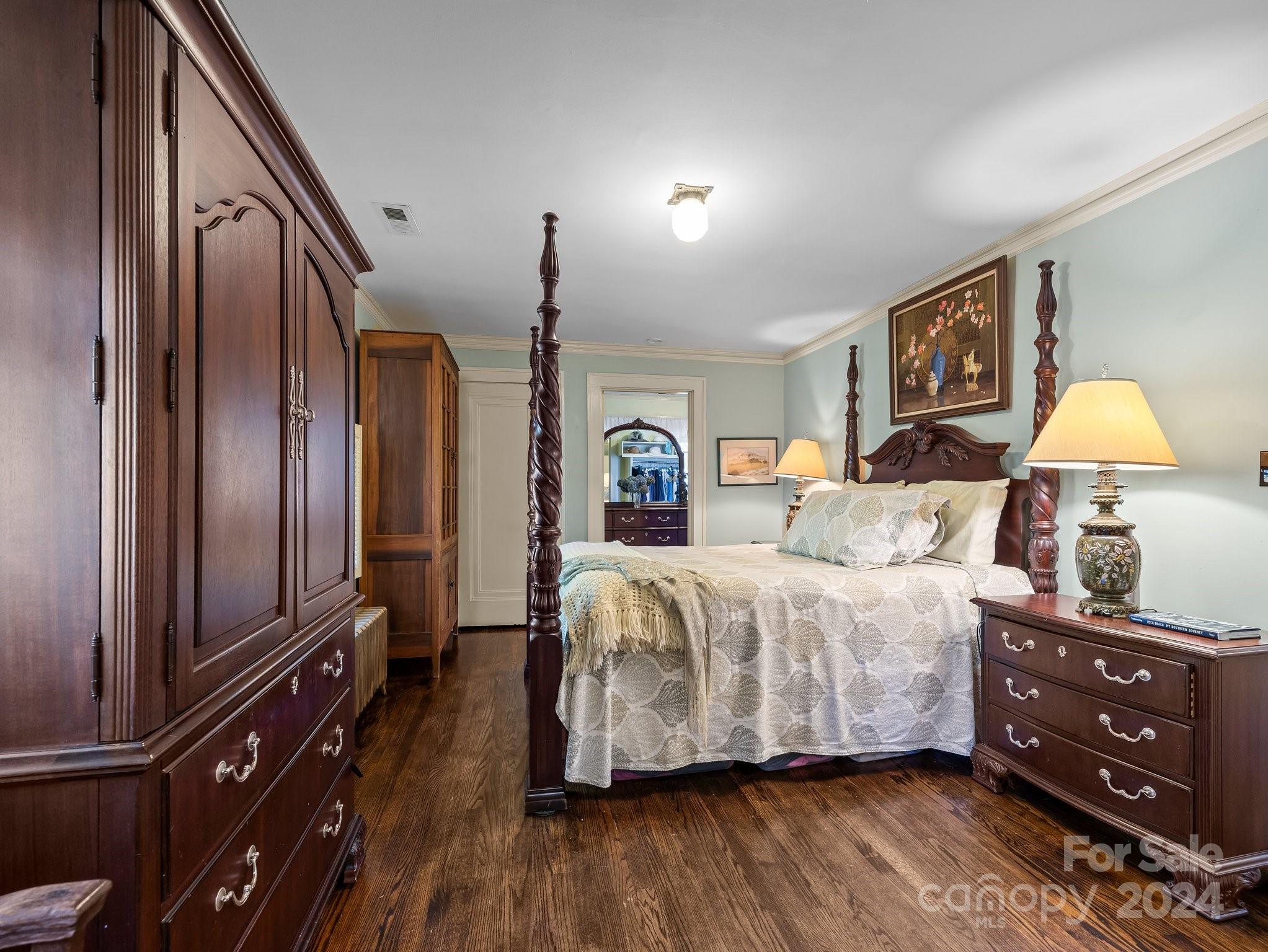 100 Edwin Place Asheville, NC 28801 - Photo 21 of 35 a bedroom with a bed and wooden floor