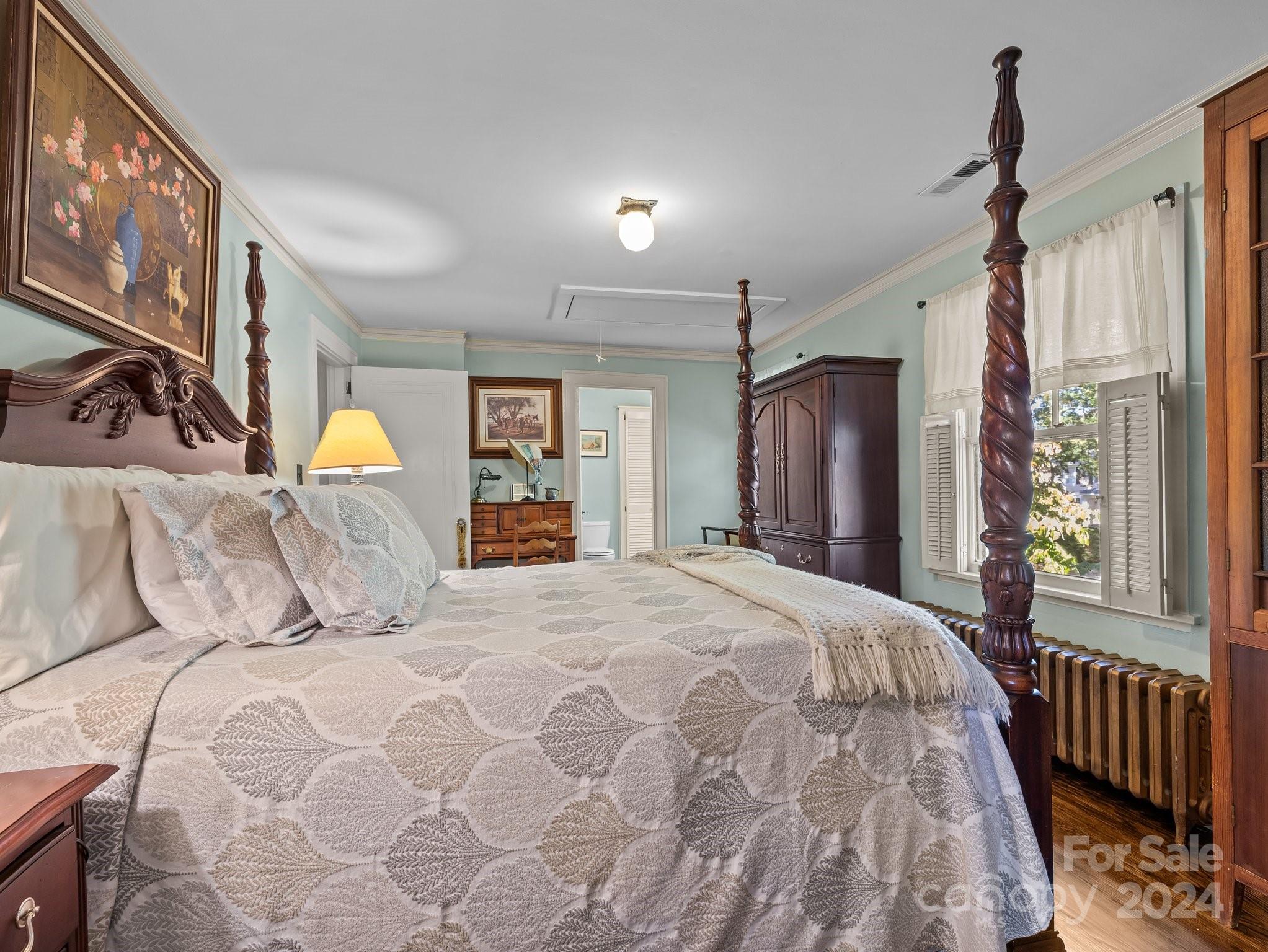 100 Edwin Place Asheville, NC 28801 - Photo 22 of 35 a bedroom with a large bed and a window