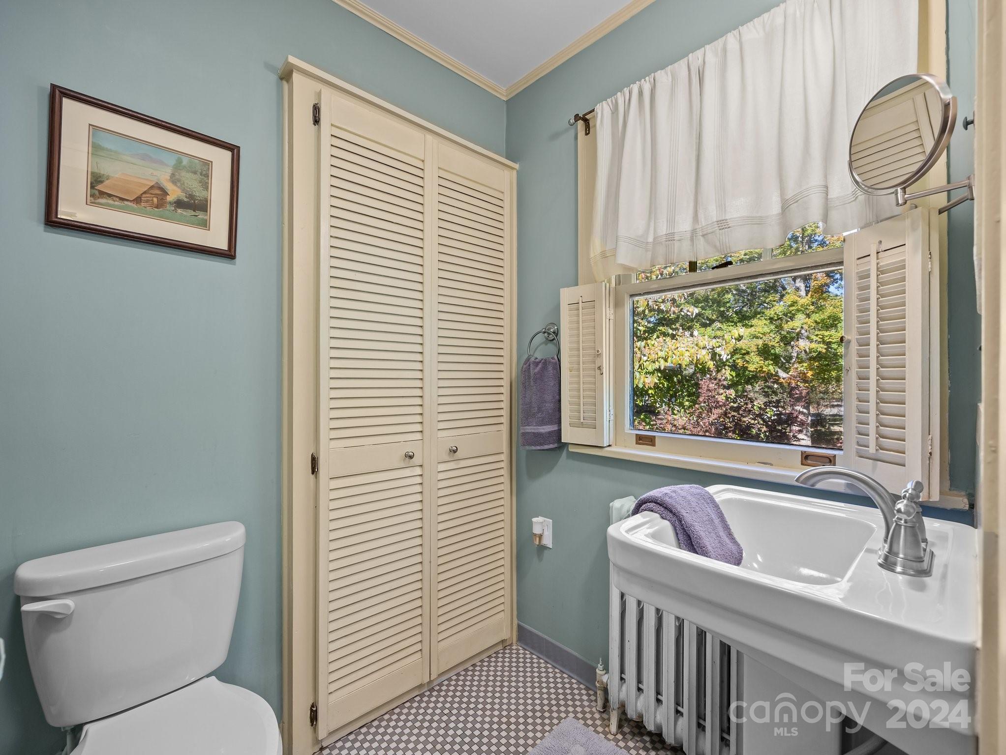 100 Edwin Place Asheville, NC 28801 - Photo 26 of 35 a bathroom with a toilet and a sink
