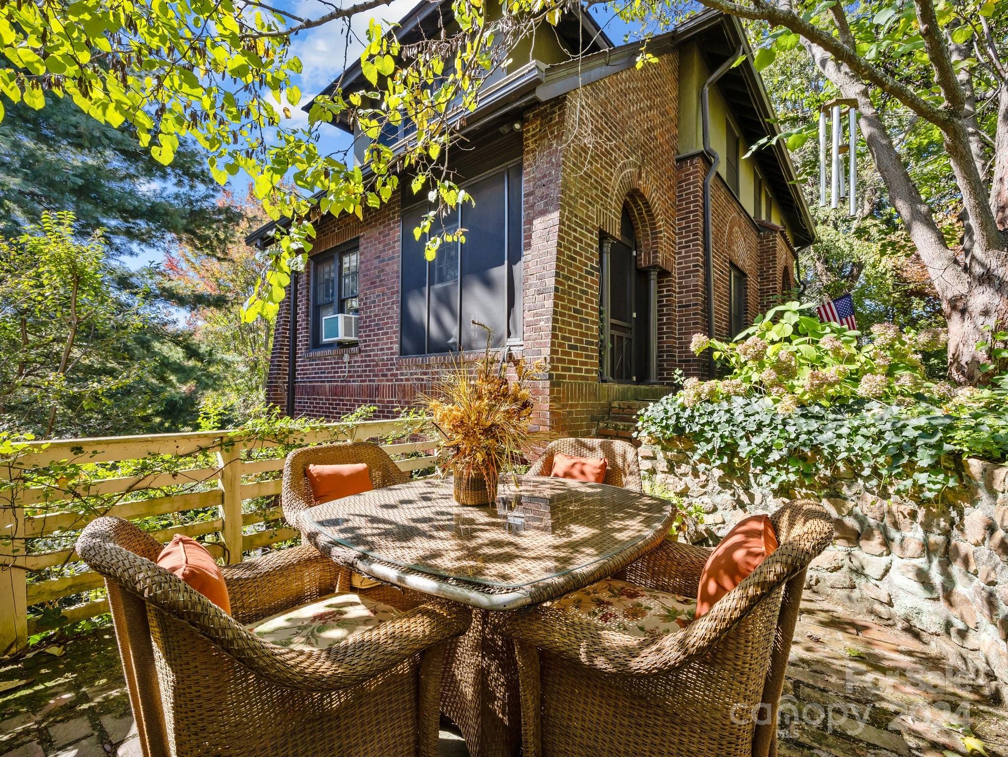 100 Edwin Place Asheville, NC 28801 - Photo 29 of 35 a view of a patio with table and chairs and potted plants