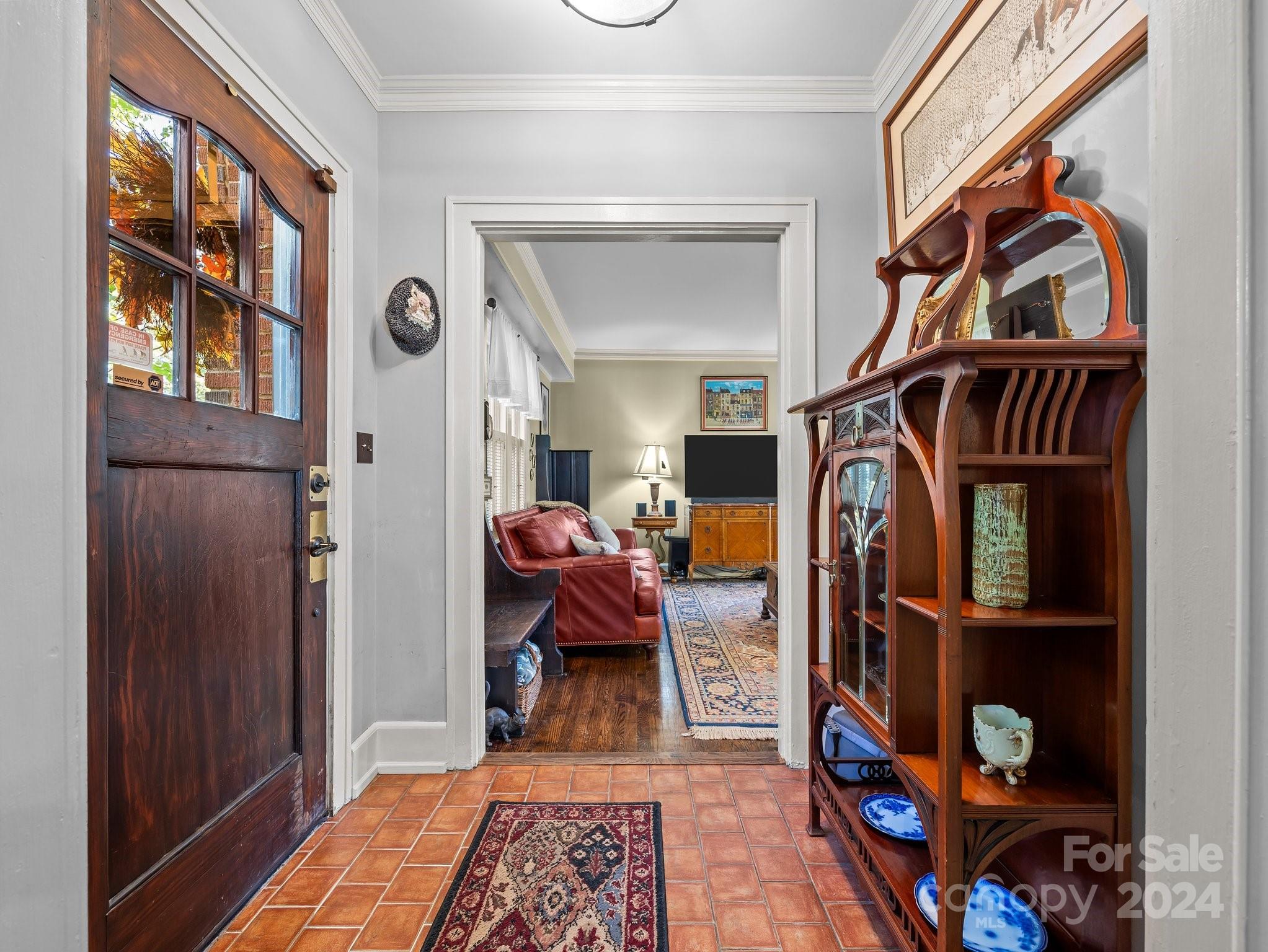 100 Edwin Place Asheville, NC 28801 - Photo 3 of 35 a living room with furniture and a book shelf