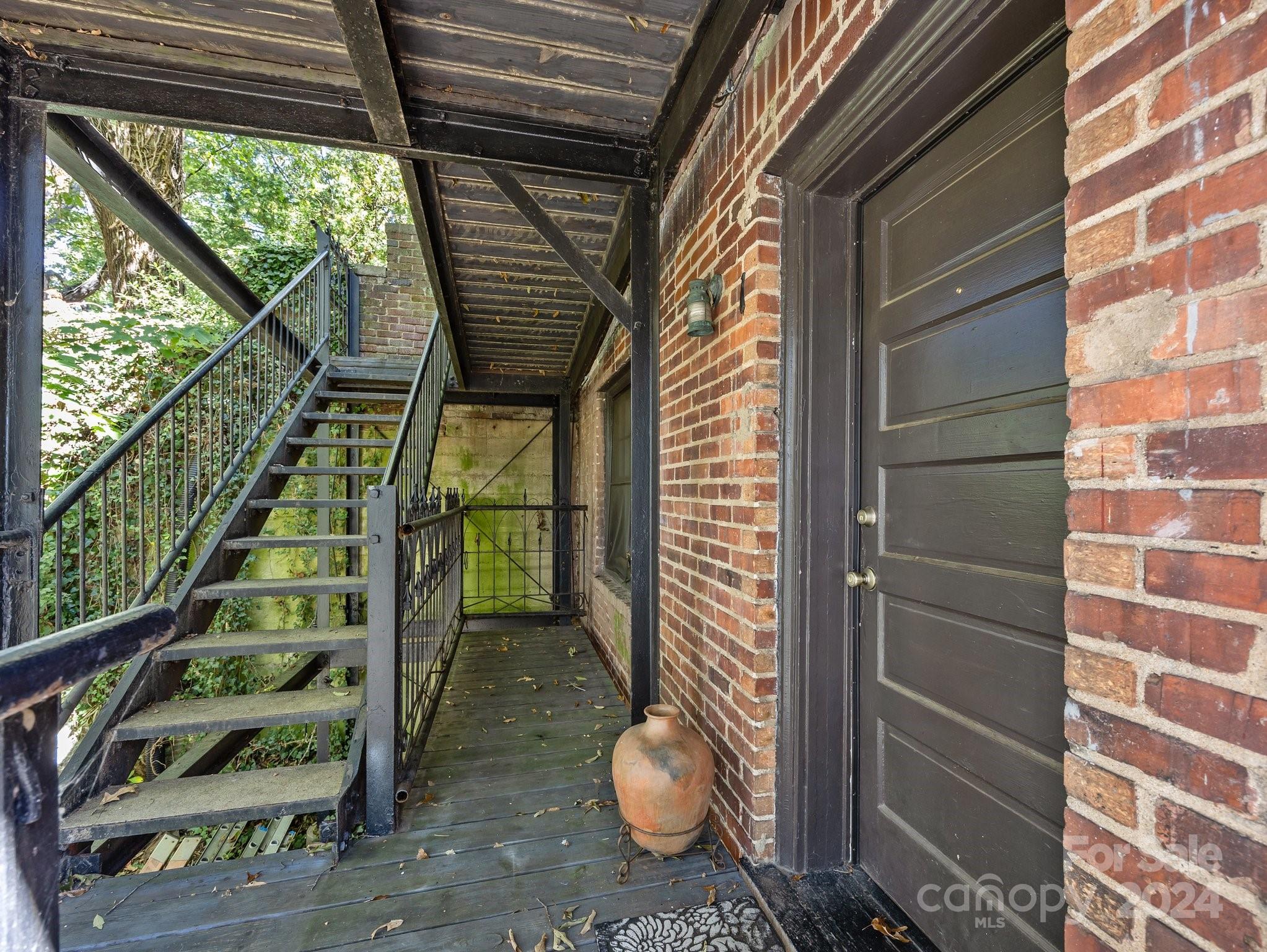 100 Edwin Place Asheville, NC 28801 - Photo 33 of 35 a view of staircase with wooden door and glass door