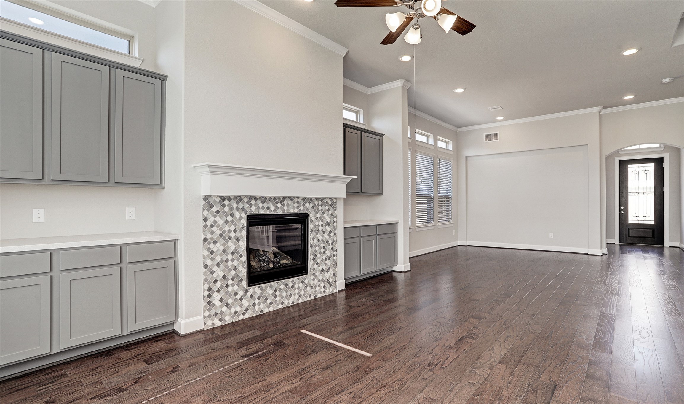 136 Peninsula Point Drive Montgomery, TX 77356 - Photo 19 of 36 a view of an empty room with wooden floor and a fireplace