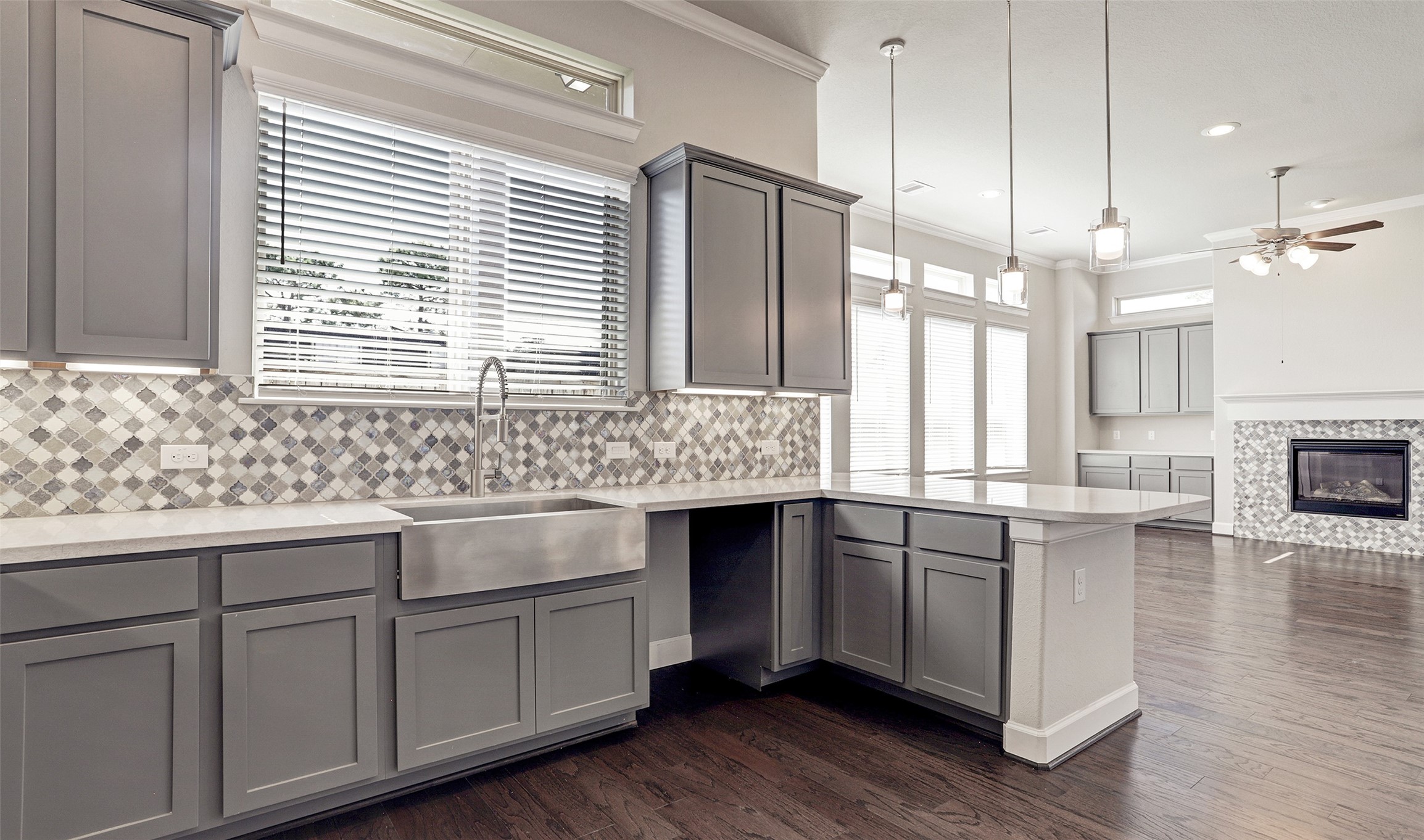 136 Peninsula Point Drive Montgomery, TX 77356 - Photo 21 of 36 a kitchen with granite countertop white cabinets and white appliances