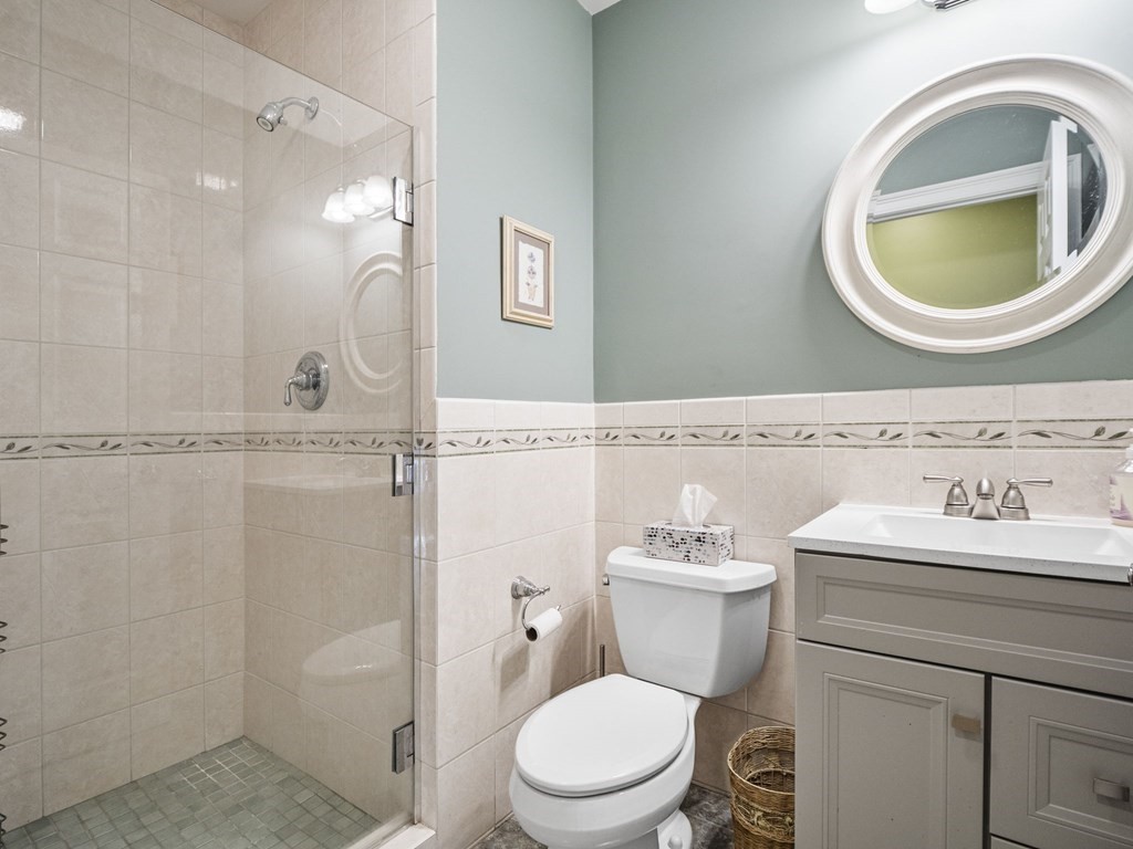 90 Howes Path Dennis, MA 02638 - Photo 14 of 42 a bathroom with a toilet a sink and a mirror