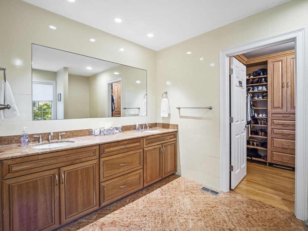 90 Howes Path Dennis, MA 02638 - Photo 18 of 42 a bathroom with a double vanity sink and a mirror