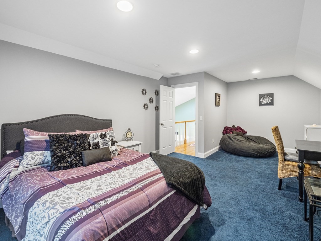 90 Howes Path Dennis, MA 02638 - Photo 24 of 42 a bedroom with a bed and a chair