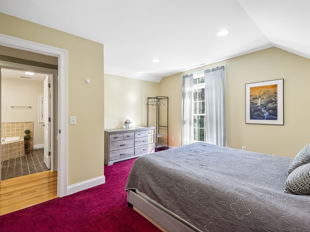 90 Howes Path Dennis, MA 02638 - Photo 27 of 42 a bedroom with a large bed and a walk in closet