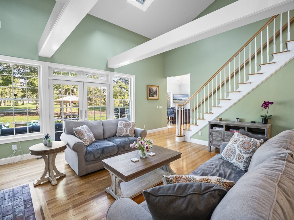 90 Howes Path Dennis, MA 02638 - Photo 3 of 42 a living room with furniture and a large window