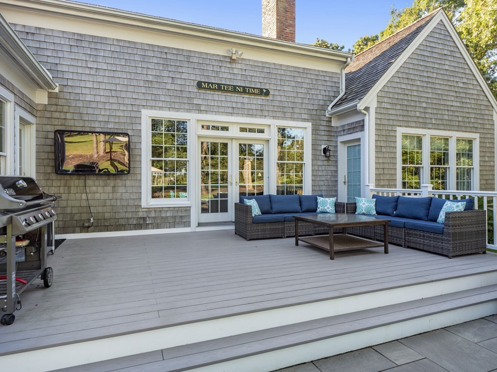 90 Howes Path Dennis, MA 02638 - Photo 33 of 42 a living room with furniture a flat screen tv and large window