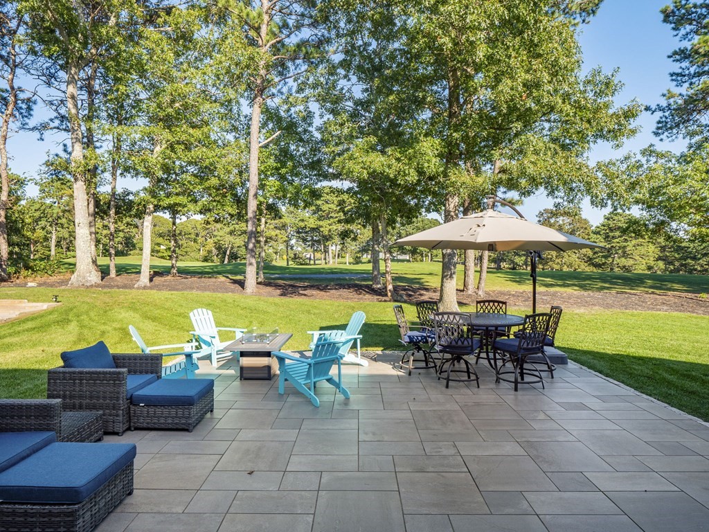 90 Howes Path Dennis, MA 02638 - Photo 35 of 42 an outdoor space with furniture and umbrella