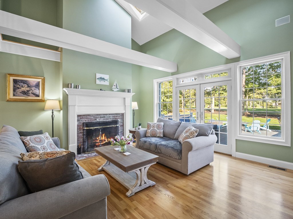 90 Howes Path Dennis, MA 02638 - Photo 4 of 42 a living room with furniture and a fireplace