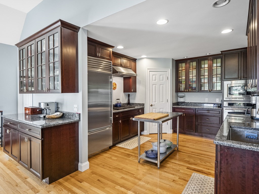 90 Howes Path Dennis, MA 02638 - Photo 10 of 42 a kitchen with granite countertop stainless steel appliances and wooden cabinets
