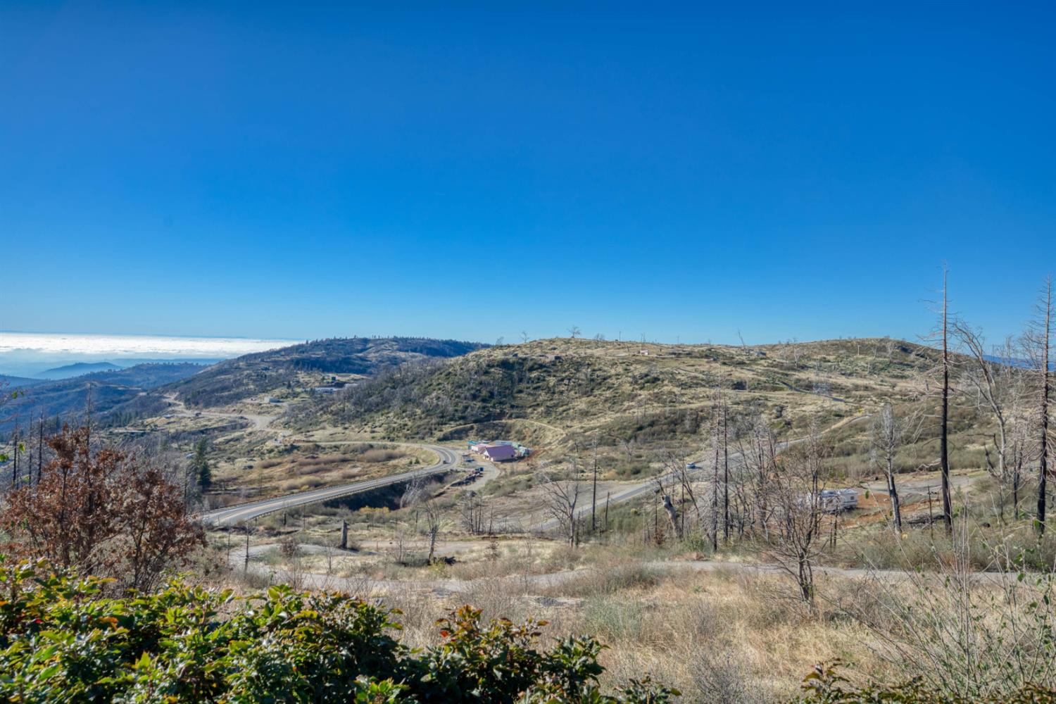 36324 Pine Ridge Lane Shaver Lake, CA 93664 - Photo 5 of 7 a view of a dry yard with wooden fence