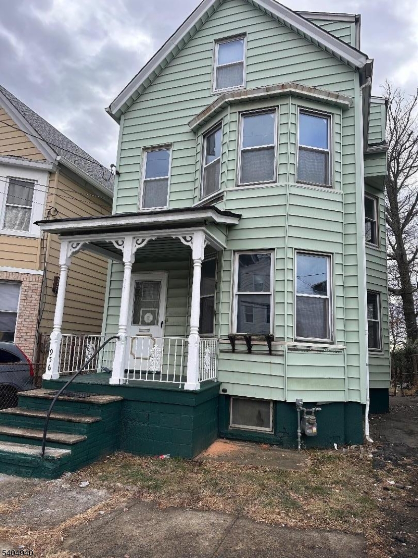 a front view of house with stairs