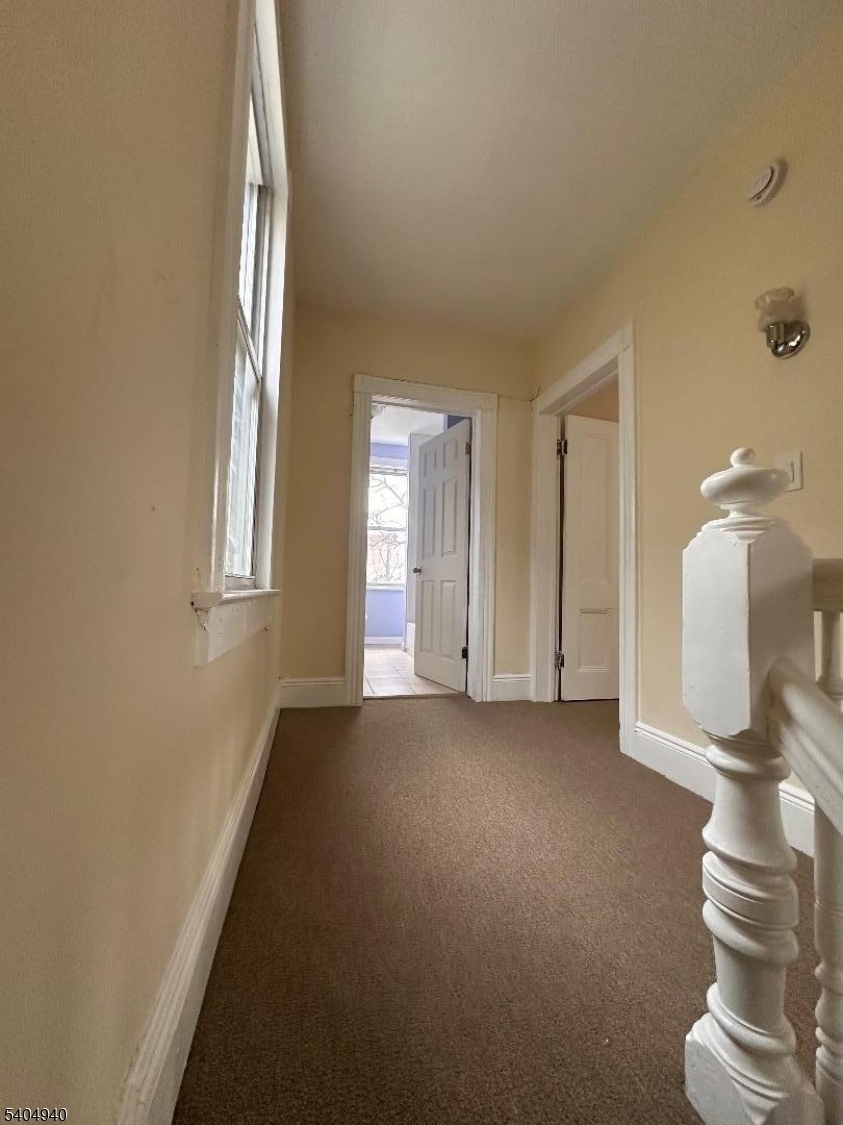 956 Lafayette Street Elizabeth, NJ 07201 - Photo 12 of 20 a view of entryway and hall with a window