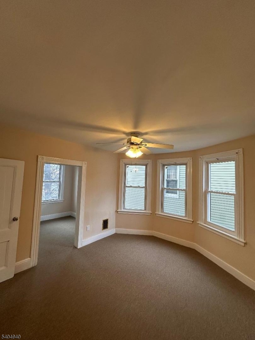 956 Lafayette Street Elizabeth, NJ 07201 - Photo 16 of 20 an empty room with windows and view