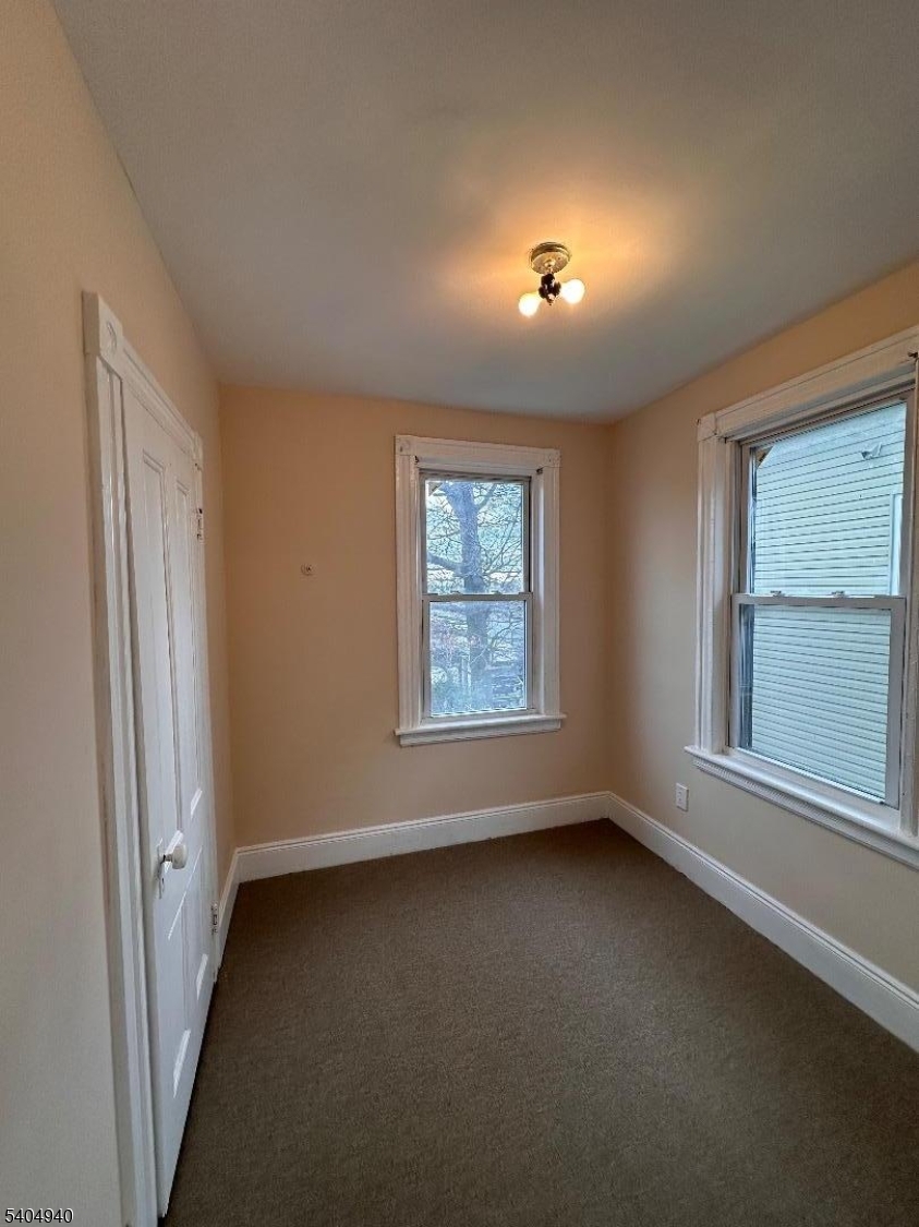 956 Lafayette Street Elizabeth, NJ 07201 - Photo 17 of 20 an empty room with a window