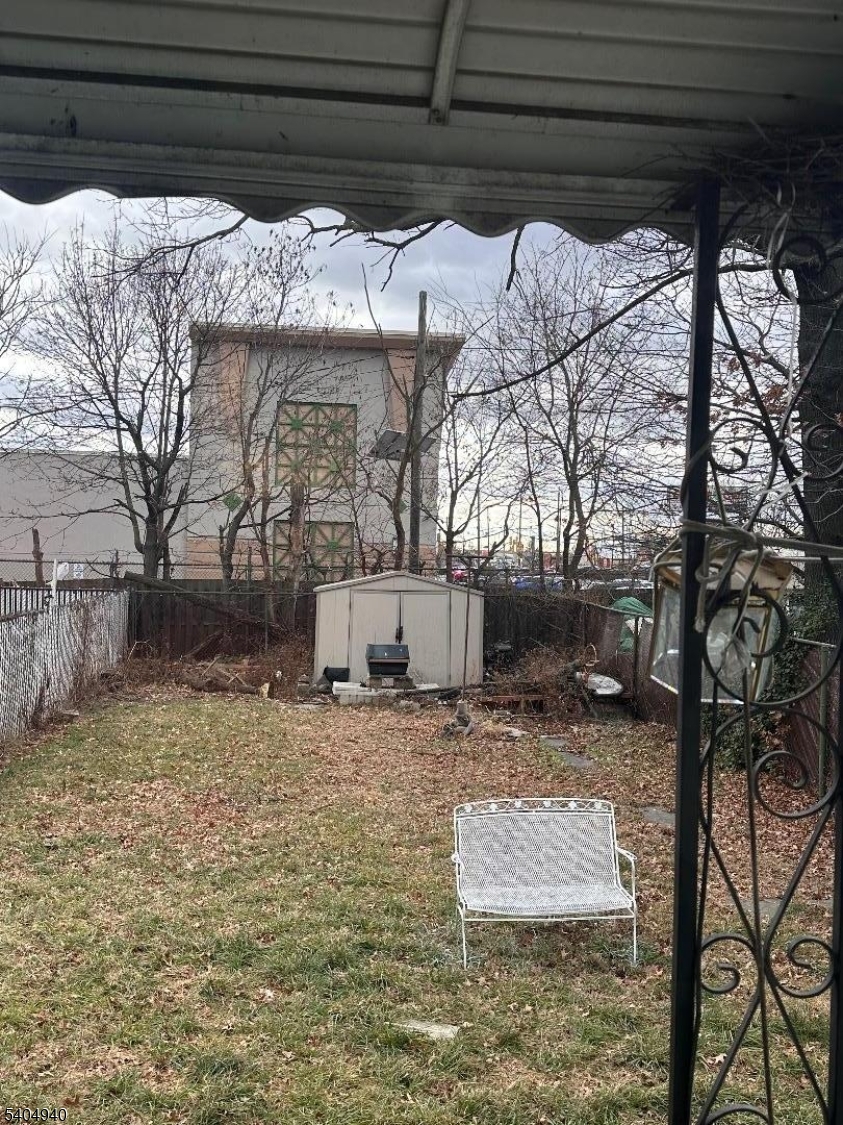 956 Lafayette Street Elizabeth, NJ 07201 - Photo 20 of 20 a view of a yard with wooden fence