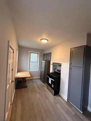 a living room with a couch and a walk in closet