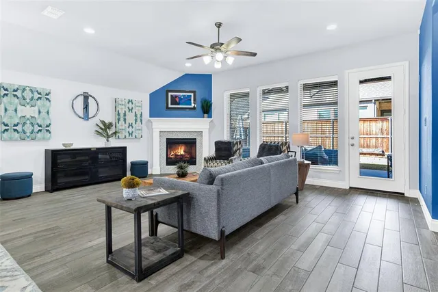 a living room with furniture and a fireplace