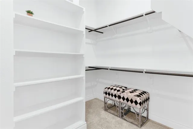 a bedroom with a bed and a chair