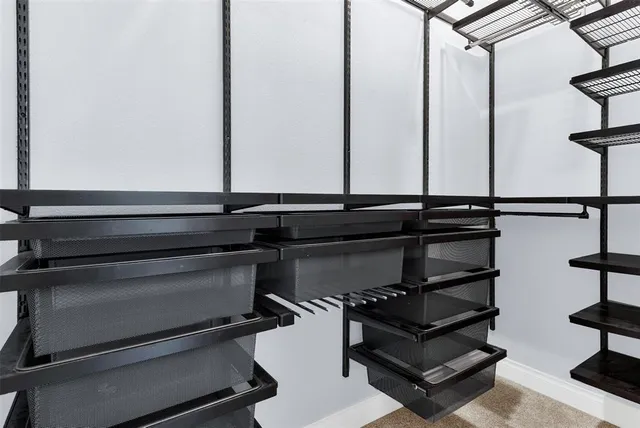 a bed room with a bed and a dresser