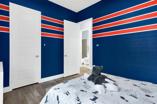 a view of hallway with wooden floor