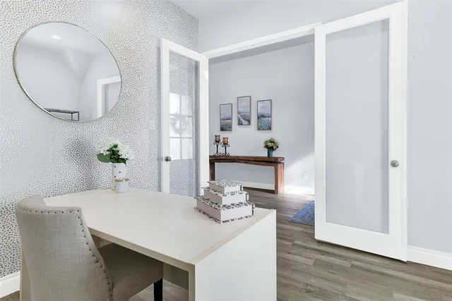 a dining room with furniture and wooden floor