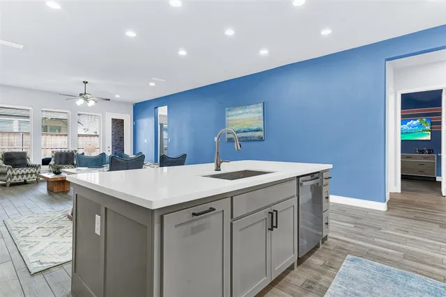 a kitchen with a sink and cabinets