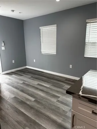 a view of workspace with wooden floor