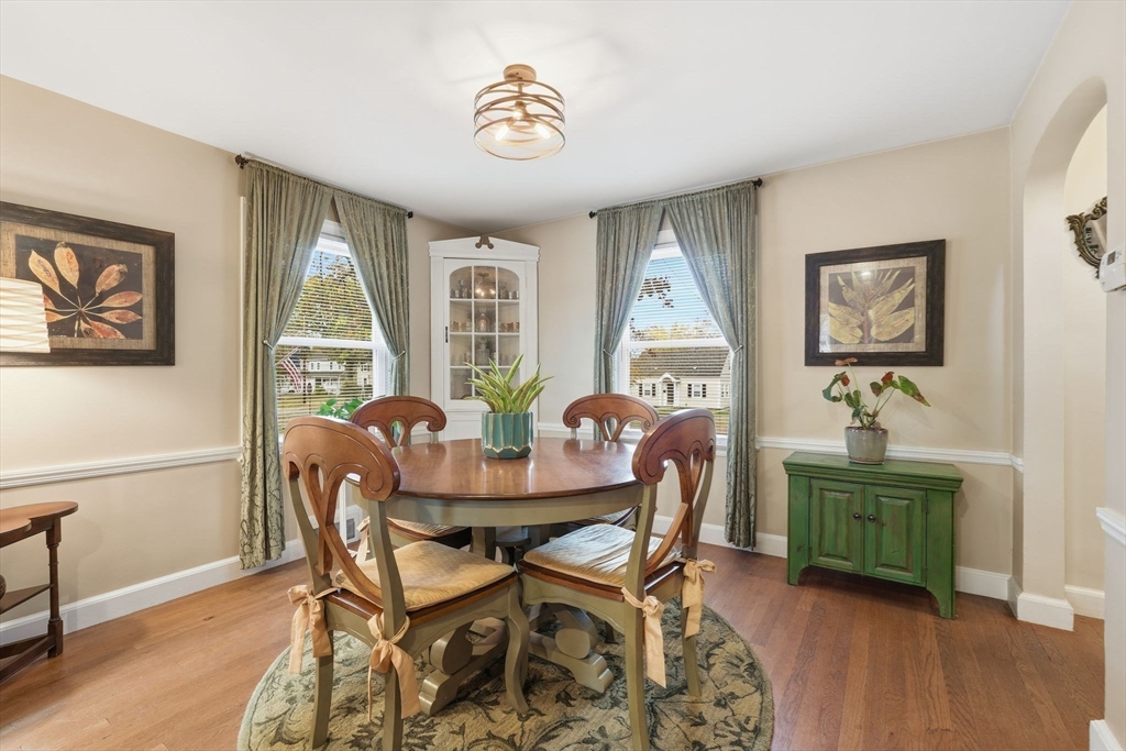 32 Pennsylvania Avenue Springfield, MA 01118 - Photo 12 of 41 a view of a dining room with furniture a chandelier and wooden floor