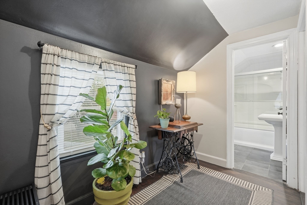 32 Pennsylvania Avenue Springfield, MA 01118 - Photo 19 of 41 a room with a table and a potted plant