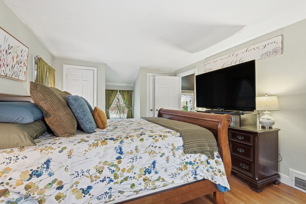 32 Pennsylvania Avenue Springfield, MA 01118 - Photo 22 of 41 a bedroom with a bed and a flat screen tv
