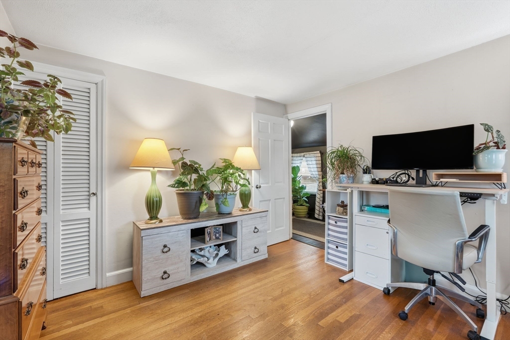 32 Pennsylvania Avenue Springfield, MA 01118 - Photo 24 of 41 a view of a workspace with furniture and wooden floor