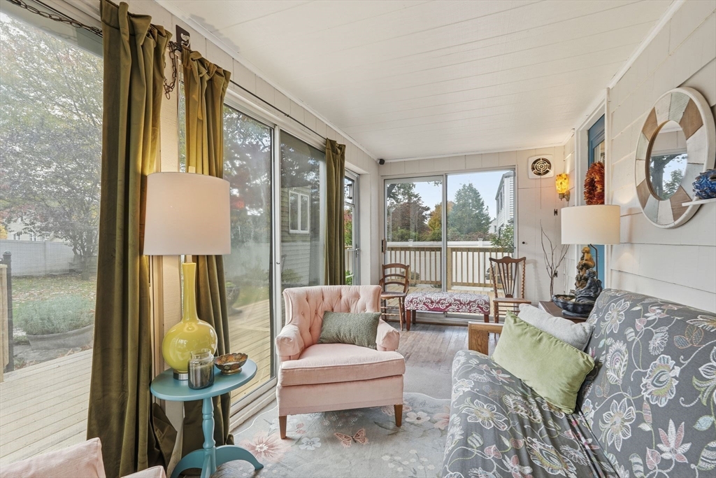 32 Pennsylvania Avenue Springfield, MA 01118 - Photo 4 of 41 a living room with furniture and a floor to ceiling window