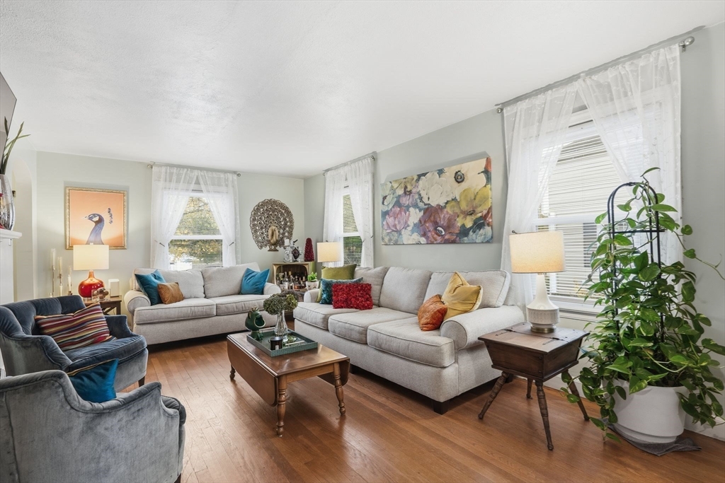 32 Pennsylvania Avenue Springfield, MA 01118 - Photo 9 of 41 a living room with furniture potted plant and a large window