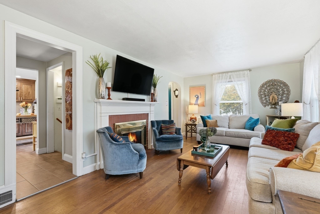 32 Pennsylvania Avenue Springfield, MA 01118 - Photo 10 of 41 a living room with fireplace furniture and a flat screen tv