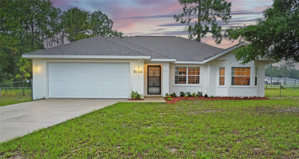7001 Hemlock Road Ocala, FL 34472 - Photo 1 of 1 front view of a house with a yard
