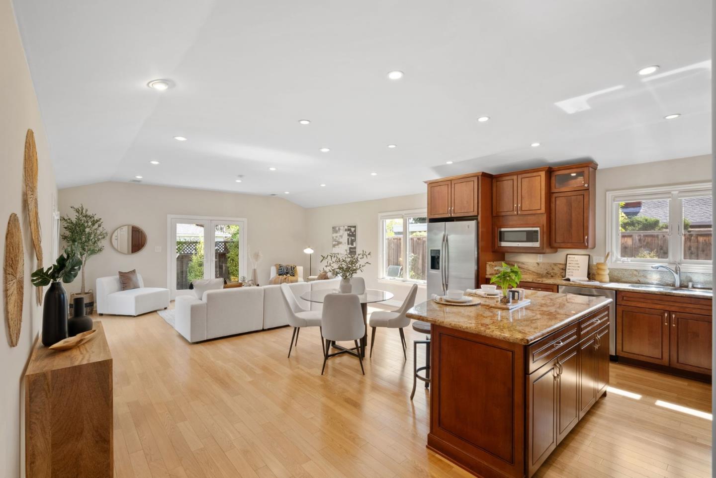 1030 Ashley Place Mountain View, CA 94040 - Photo 12 of 32 a living room with stainless steel appliances kitchen island granite countertop a stove a sink a dining table and chairs