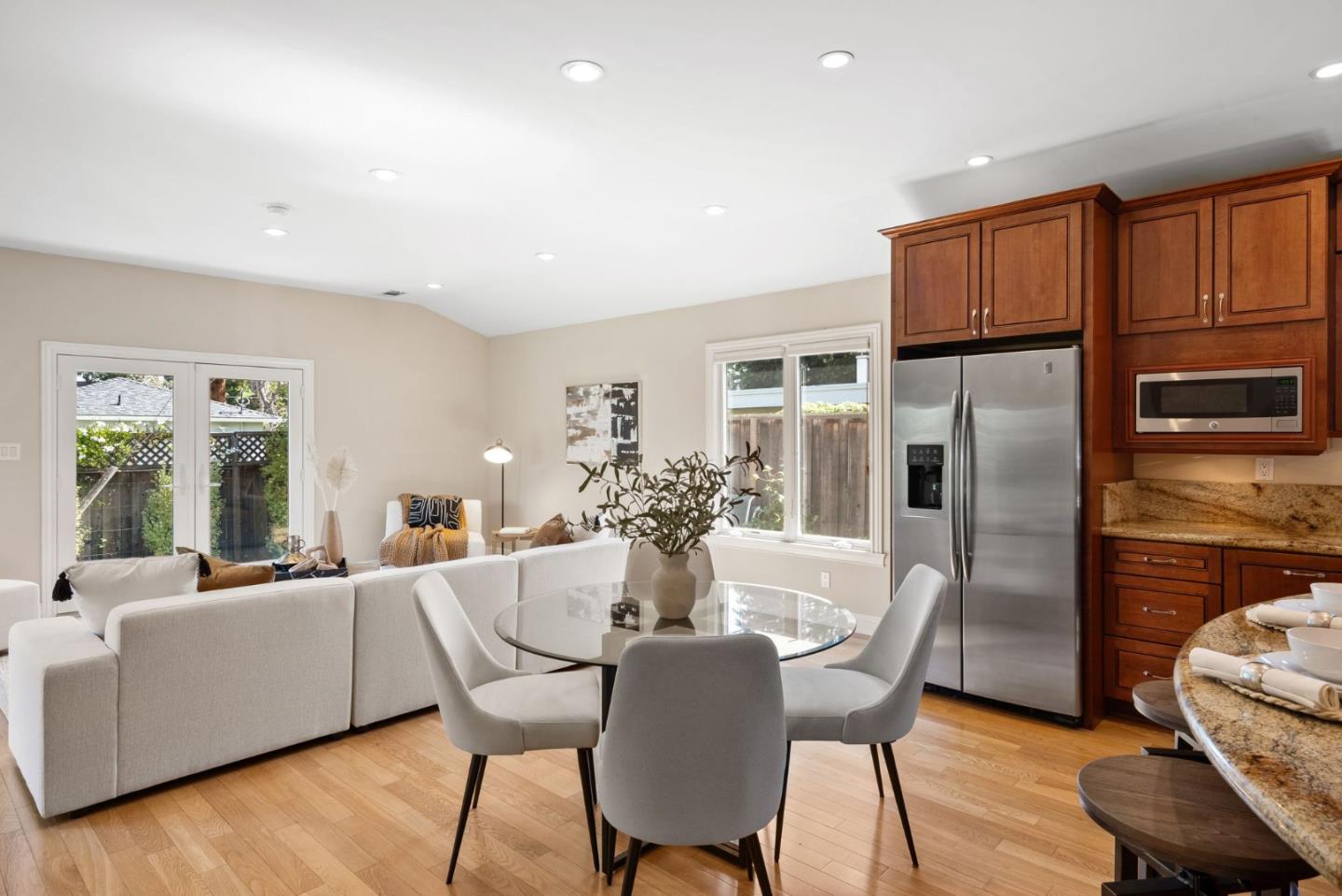 1030 Ashley Place Mountain View, CA 94040 - Photo 13 of 32 a dining room with furniture a kitchen view and wooden floor