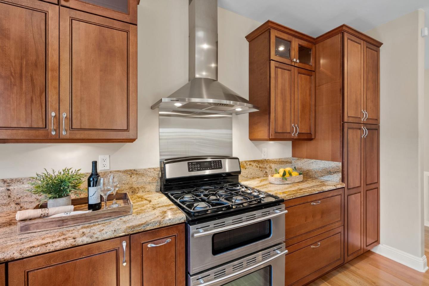 1030 Ashley Place Mountain View, CA 94040 - Photo 16 of 32 a kitchen with granite countertop stainless steel appliances a stove a sink and cabinets