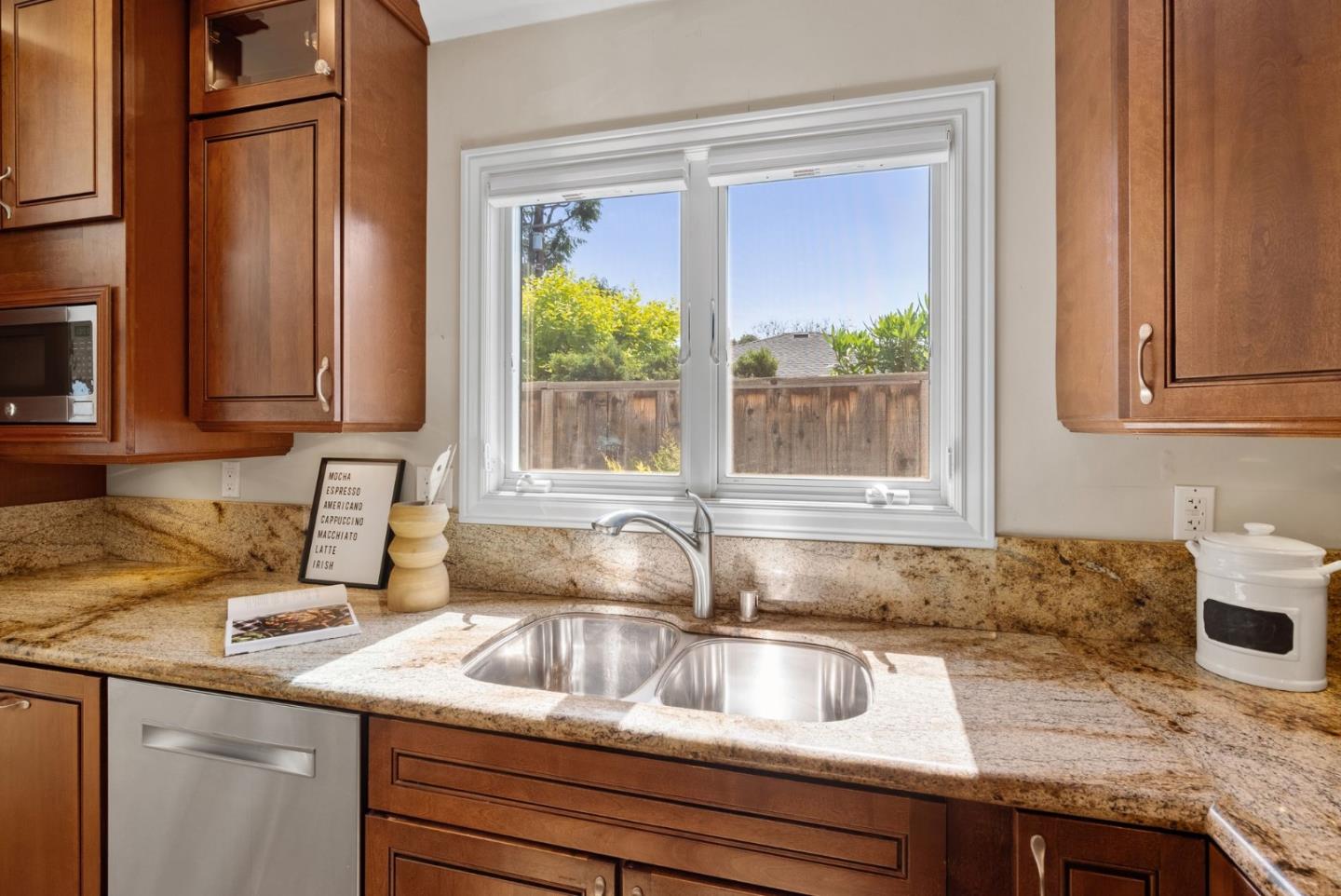 1030 Ashley Place Mountain View, CA 94040 - Photo 17 of 32 a kitchen with granite countertop a sink and a window