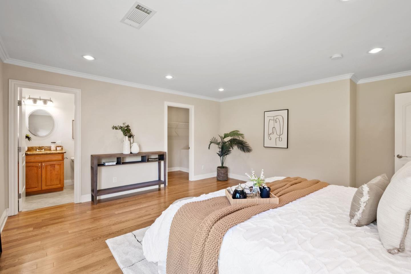 1030 Ashley Place Mountain View, CA 94040 - Photo 19 of 32 a bedroom with a large bed and a chandelier