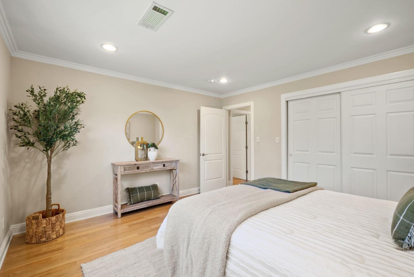 1030 Ashley Place Mountain View, CA 94040 - Photo 22 of 32 a bedroom with a bed and a potted plant