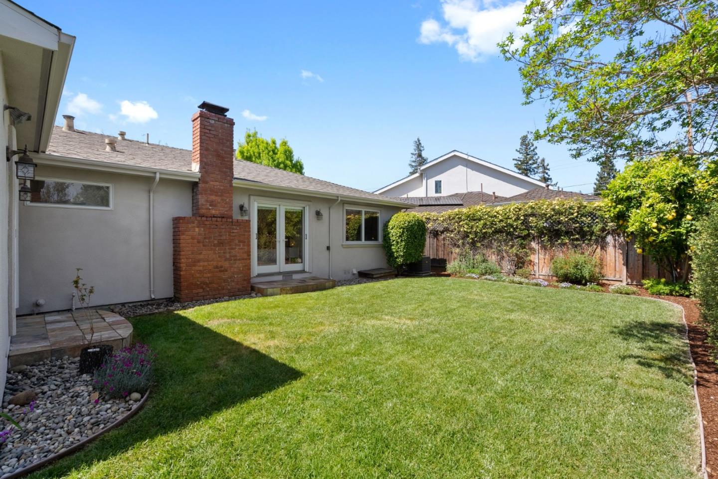 1030 Ashley Place Mountain View, CA 94040 - Photo 30 of 32 a front view of a house with a yard and garage