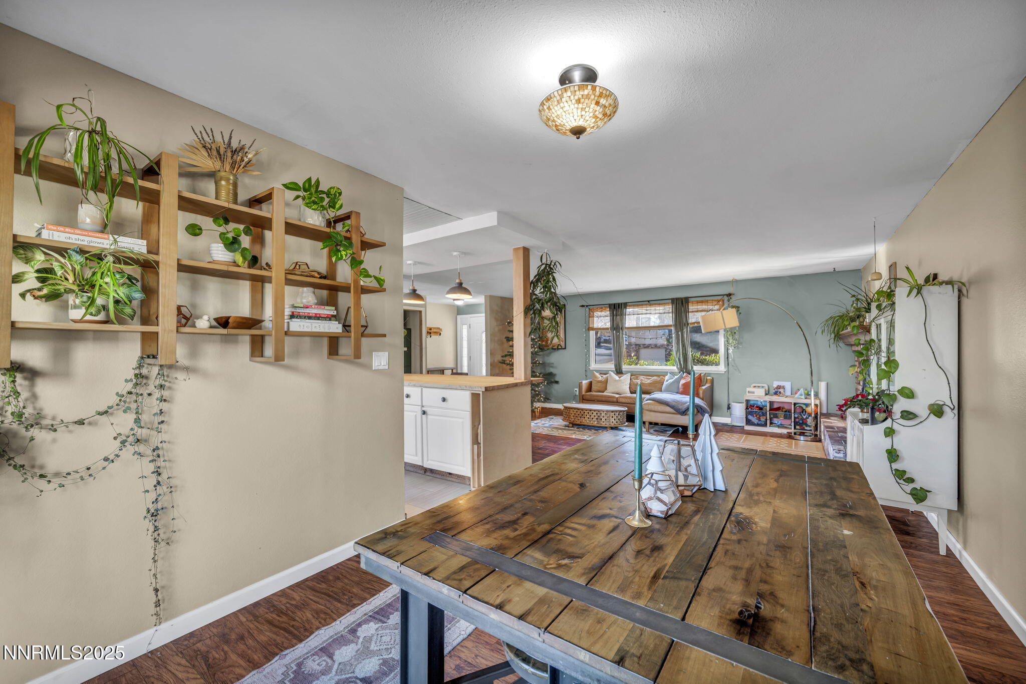 1100 Mission Circle Reno, NV 89503 - Photo 11 of 61 a view of a dining room with furniture one side kitchen view and wooden floor