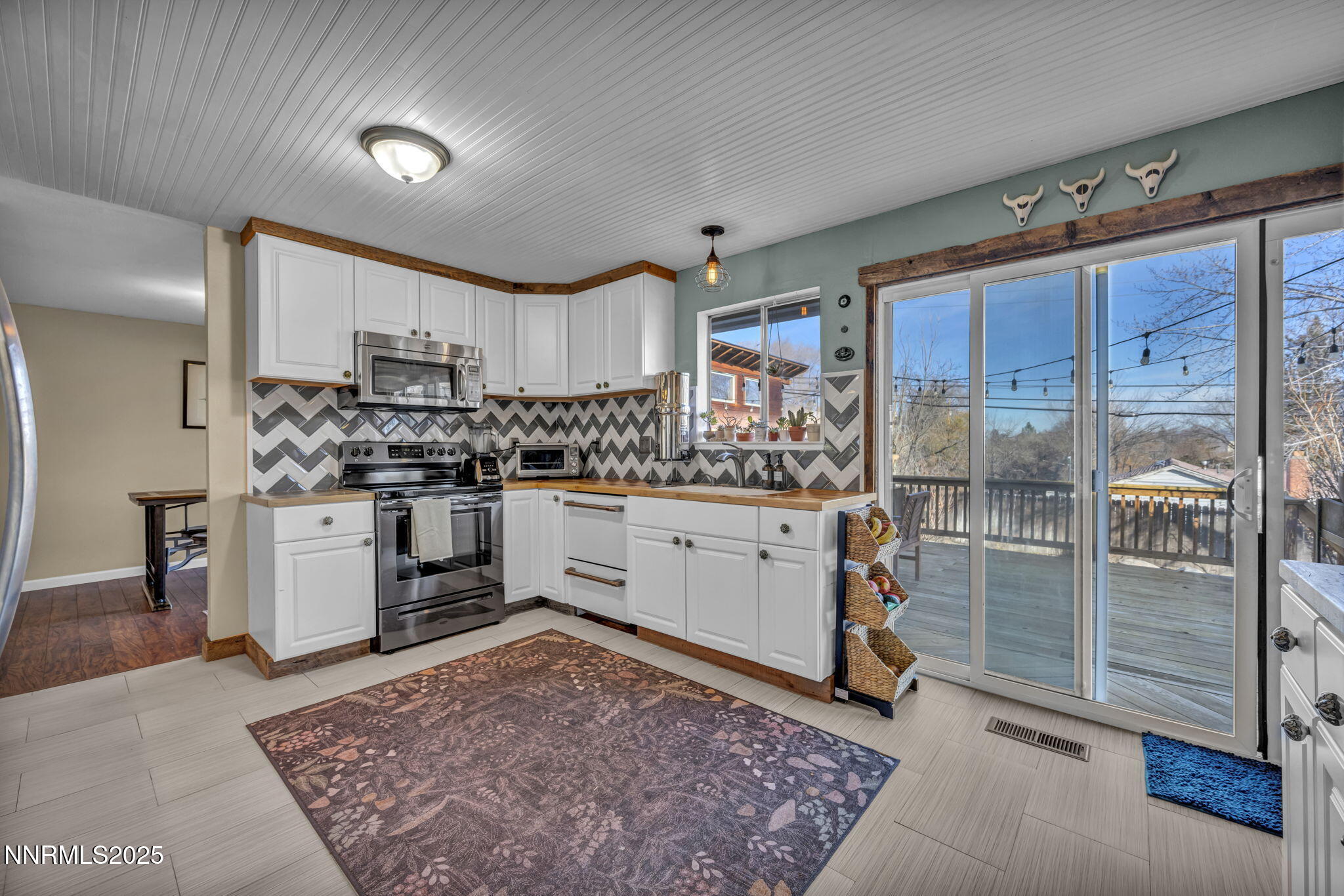 1100 Mission Circle Reno, NV 89503 - Photo 16 of 61 a kitchen with a stove a sink and a refrigerator