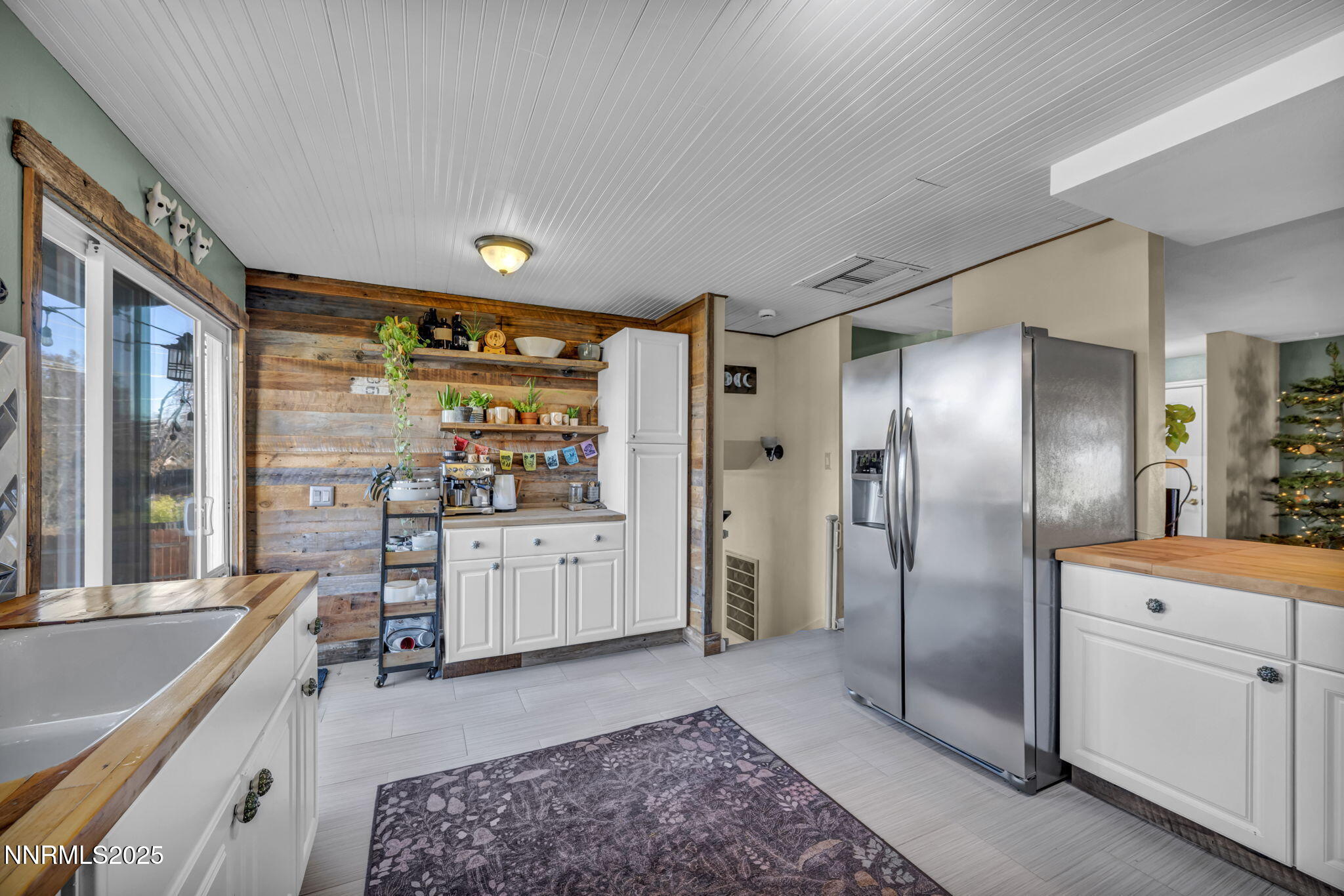 1100 Mission Circle Reno, NV 89503 - Photo 19 of 61 a large kitchen with a large window and stainless steel appliances