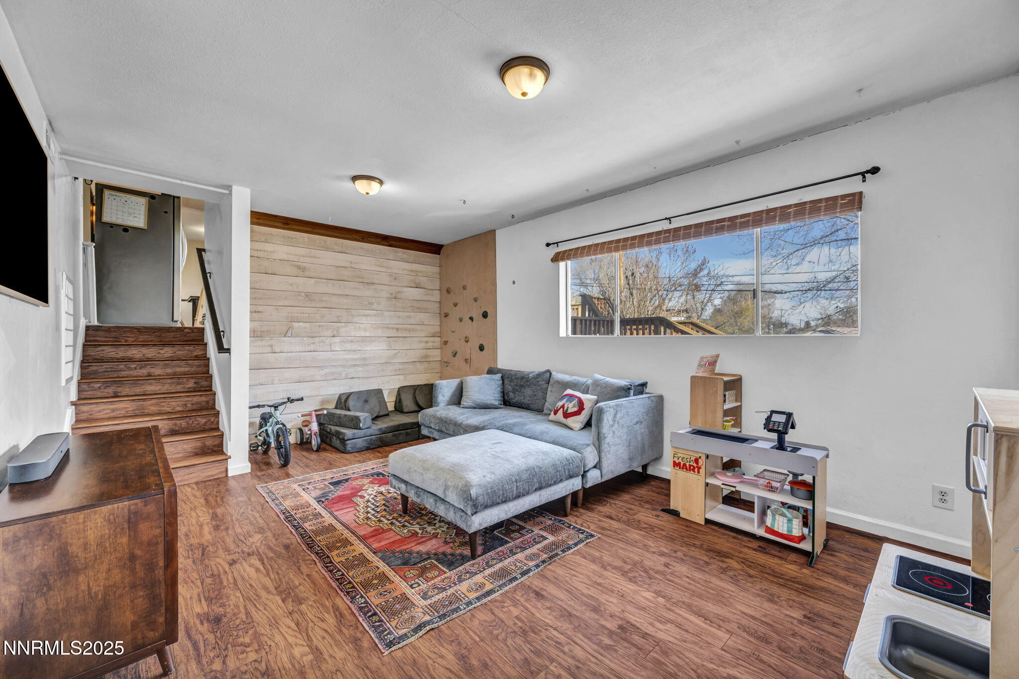 1100 Mission Circle Reno, NV 89503 - Photo 22 of 61 a bedroom with furniture and a wooden floor